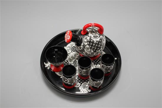 A Murano seven piece glass liqueur set, with lacework decoration, tray diameter 18cm